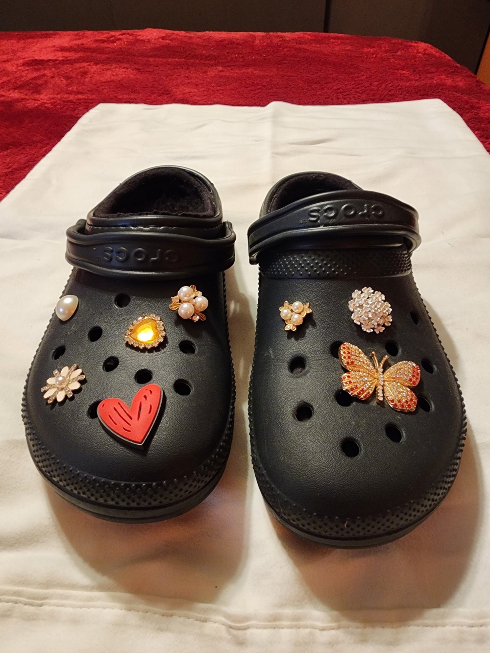 Black Crocs M9/W11 with red heart, butterfly, and pearl embellishments